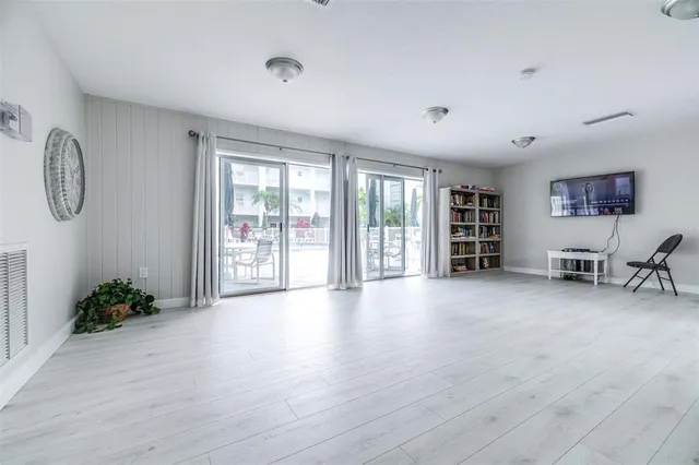 a bed room with a bed and a chair