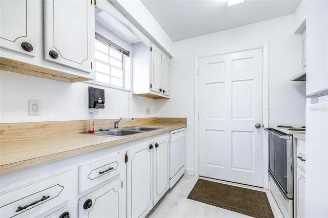 a bedroom with a bed and a mirror