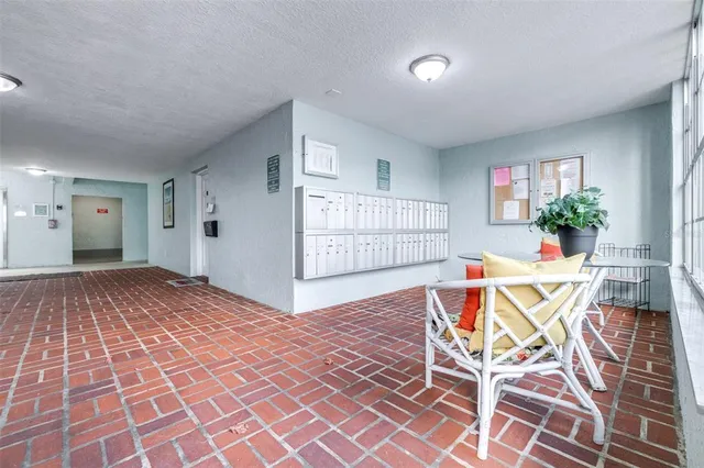 an aerial view of a house with a yard and potted plants