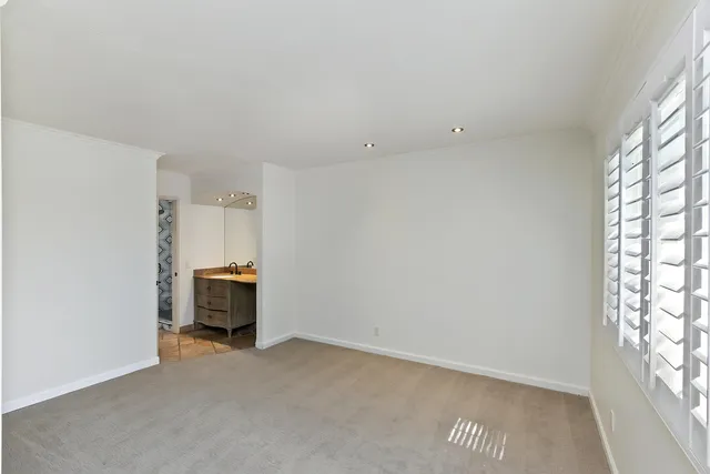 a view of a room with window and a kitchen
