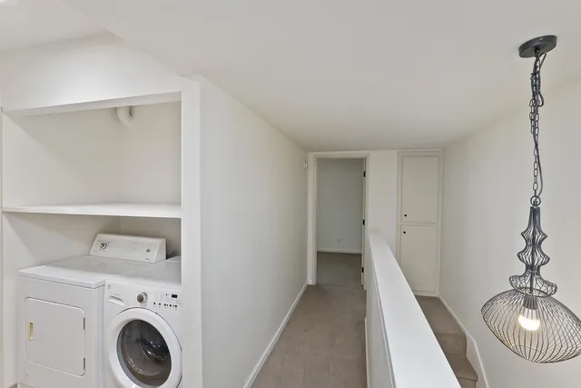 a view of a storage & utility room with washer and dryer