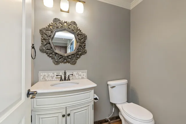 a bathroom with a toilet and a sink