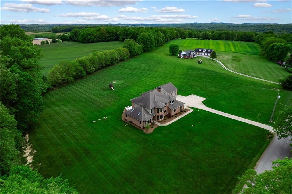 258 Smith Road Renfrew, PA 16053 - Photo 11 of 50 a backyard of a house with table and chairs