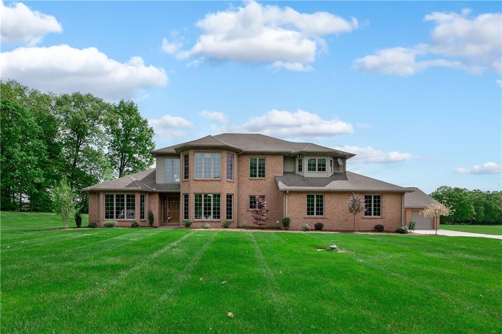 258 Smith Road Renfrew, PA 16053 - Photo 12 of 50 a front view of a house with a yard