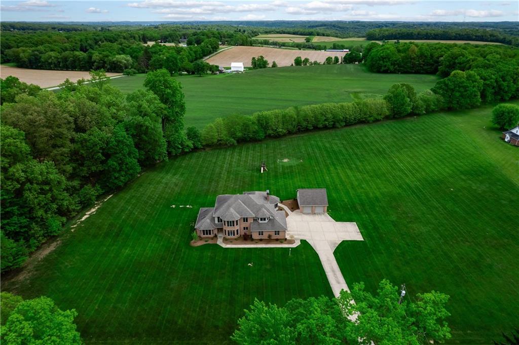258 Smith Road Renfrew, PA 16053 - Photo 13 of 50 a backyard of a house with a yard and outdoor seating
