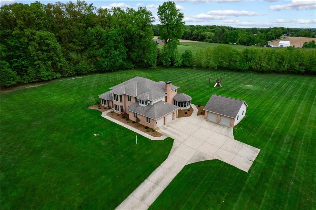258 Smith Road Renfrew, PA 16053 - Photo 15 of 50 a view of a garden with lawn chairs