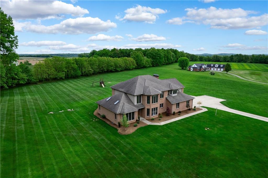 258 Smith Road Renfrew, PA 16053 - Photo 16 of 50 a view of a house with a big yard couches and large trees