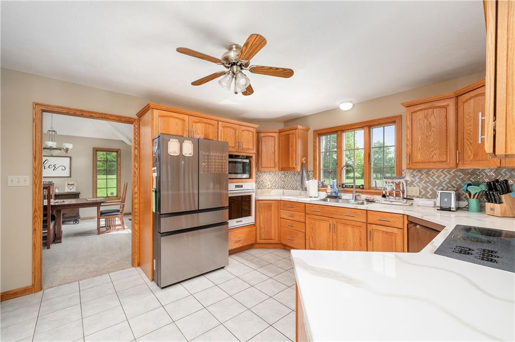 258 Smith Road Renfrew, PA 16053 - Photo 25 of 50 a kitchen with stainless steel appliances granite countertop a refrigerator and a sink