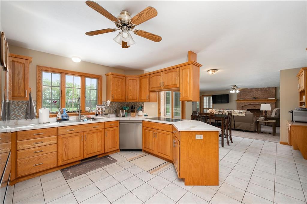 258 Smith Road Renfrew, PA 16053 - Photo 27 of 50 a open kitchen with stainless steel appliances granite countertop a stove and a sink