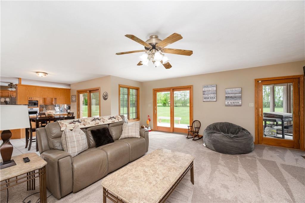 258 Smith Road Renfrew, PA 16053 - Photo 32 of 50 a living room with furniture a ceiling fan and a large window