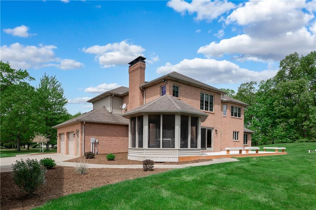 258 Smith Road Renfrew, PA 16053 - Photo 4 of 50 a front view of a house with a garden and trees
