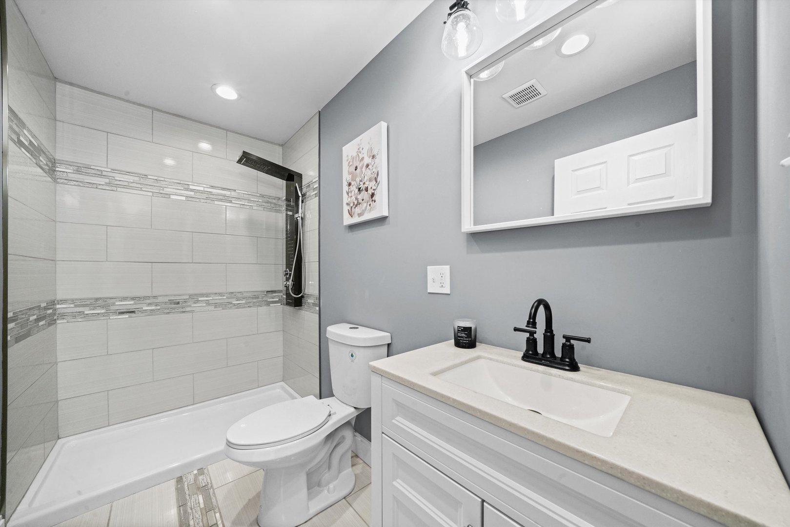 60 East 103rd Place Chicago, IL 60628 - Photo 13 of 20 a bathroom with a sink a toilet and shower