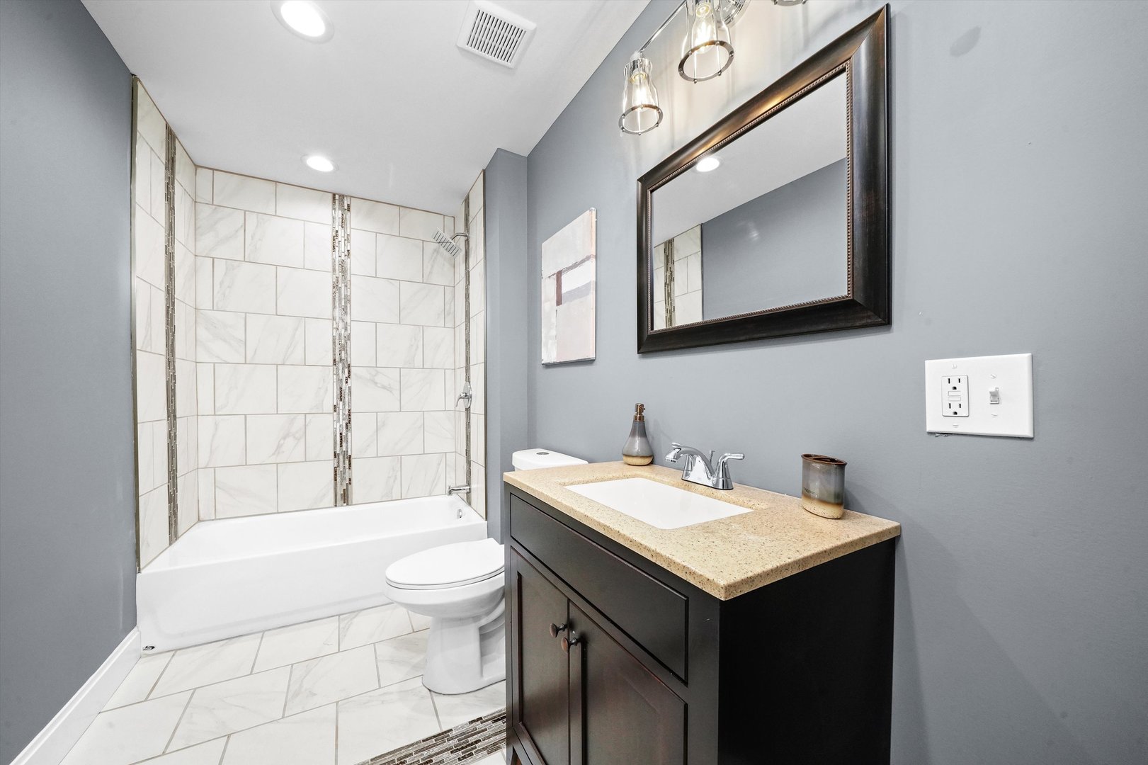 60 East 103rd Place Chicago, IL 60628 - Photo 17 of 20 a bathroom with a sink a toilet and mirror