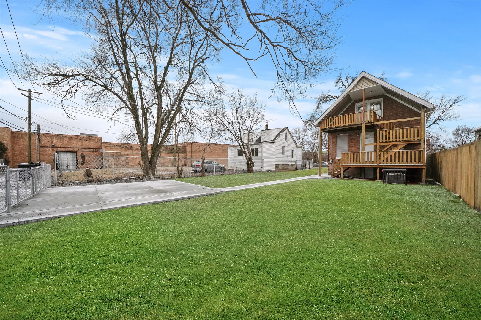 60 East 103rd Place Chicago, IL 60628 - Photo 19 of 20 a view of a house with a yard