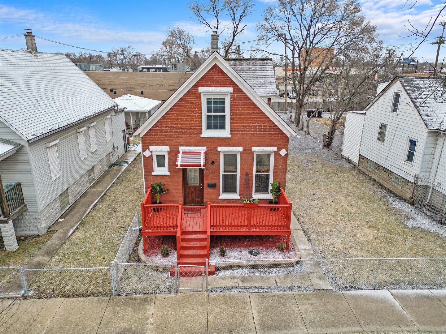 60 East 103rd Place Chicago, IL 60628 - Photo 3 of 20 a front view of a house with a yard