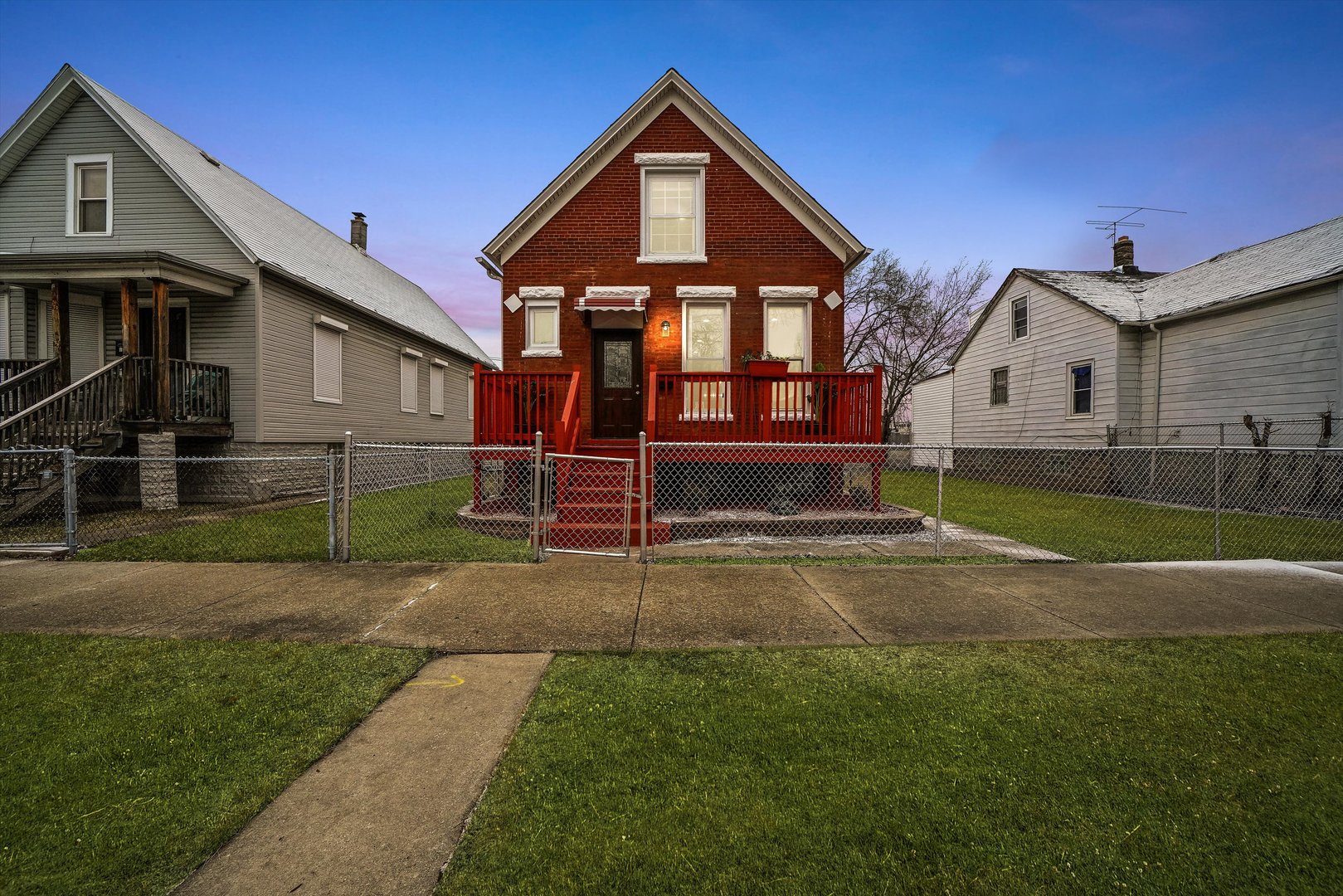 60 East 103rd Place Chicago, IL 60628 - Photo 5 of 20 a front view of a house with a yard