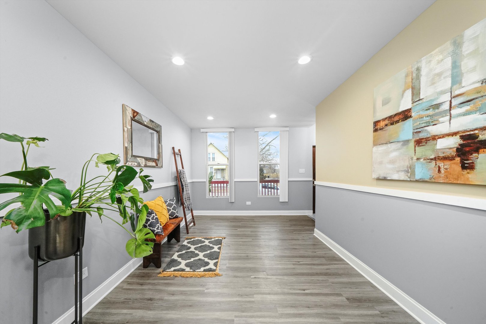 60 East 103rd Place Chicago, IL 60628 - Photo 10 of 20 a view of a hallway with wooden floor