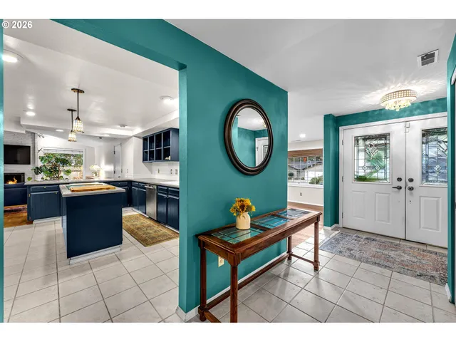 a living room with stainless steel appliances kitchen island granite countertop furniture and a view of kitchen