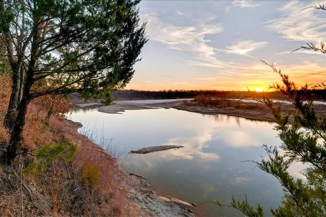 a view of lake with green space