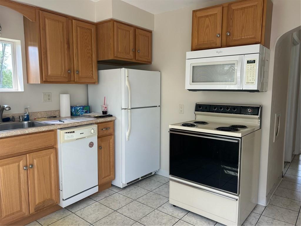 314 Terrace McKeesport, PA 15135 - Photo 4 of 19 a kitchen with white cabinets and white appliances