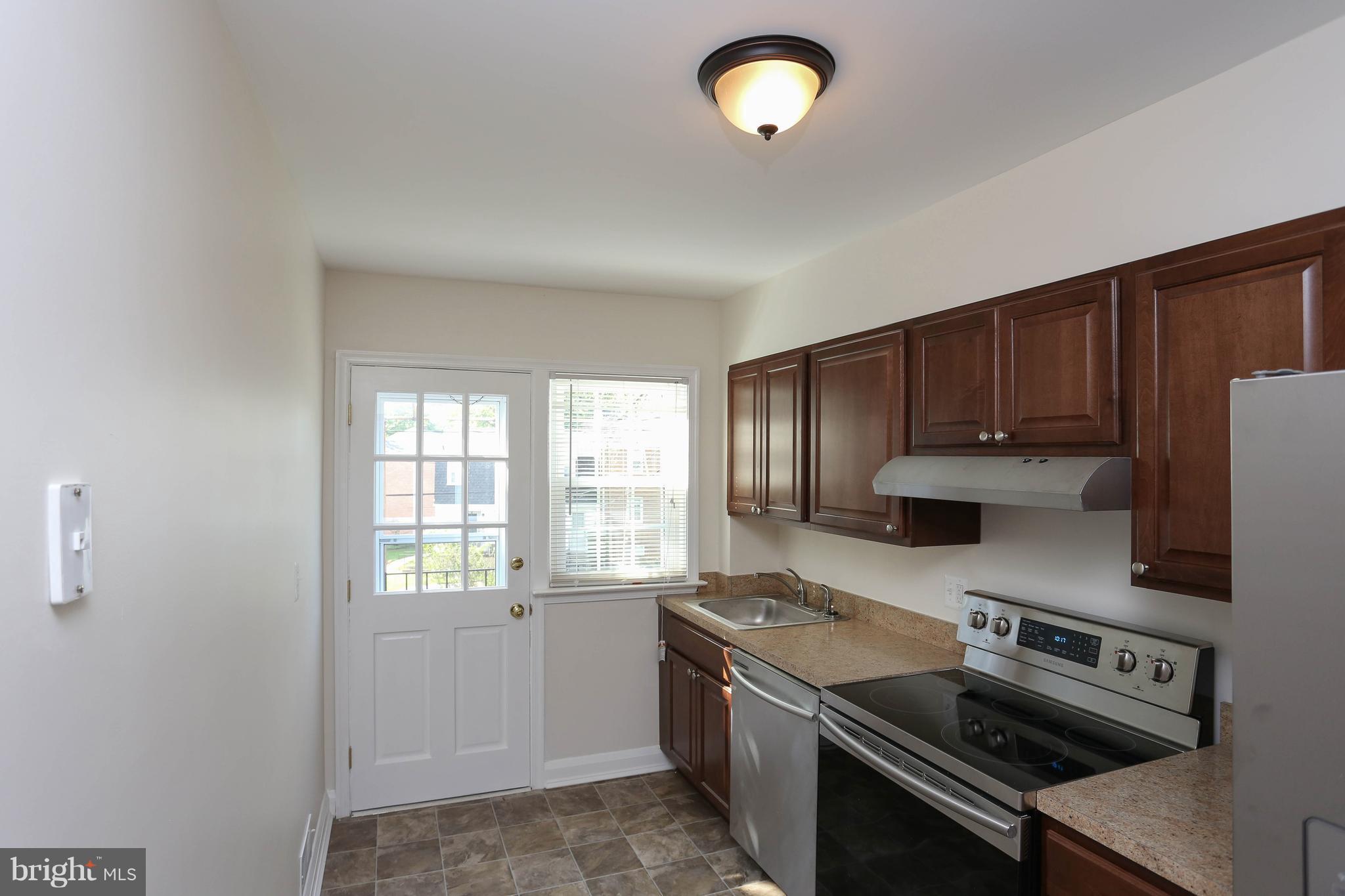 6139 Regent Park Road Baltimore, MD 21228 - Photo 9 of 27 Kitchen has walk out to the balcony
