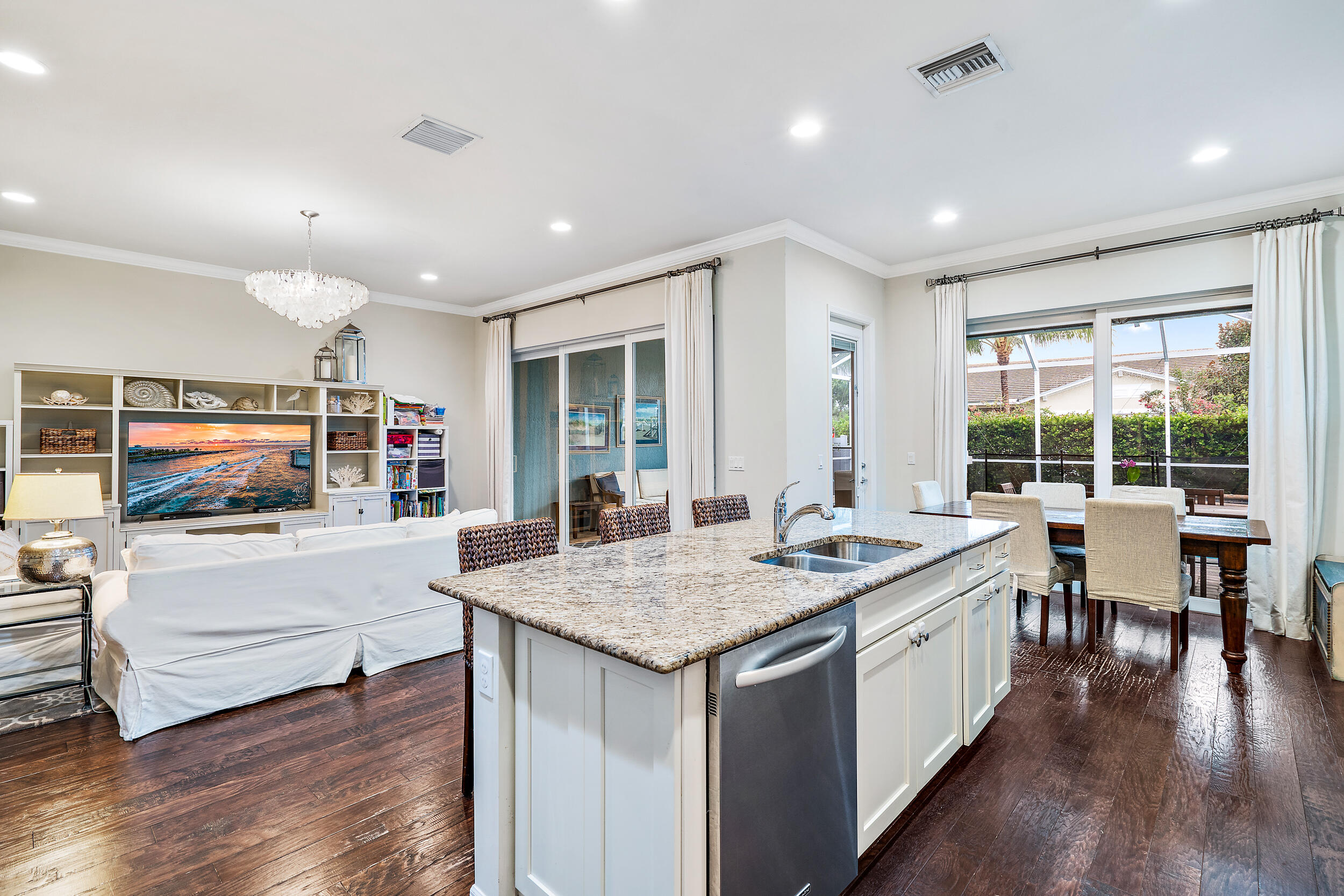 2704 Sunbury Drive Jupiter, FL 33458 - Photo 20 of 50 a open kitchen with stainless steel appliances granite countertop a stove and a large window