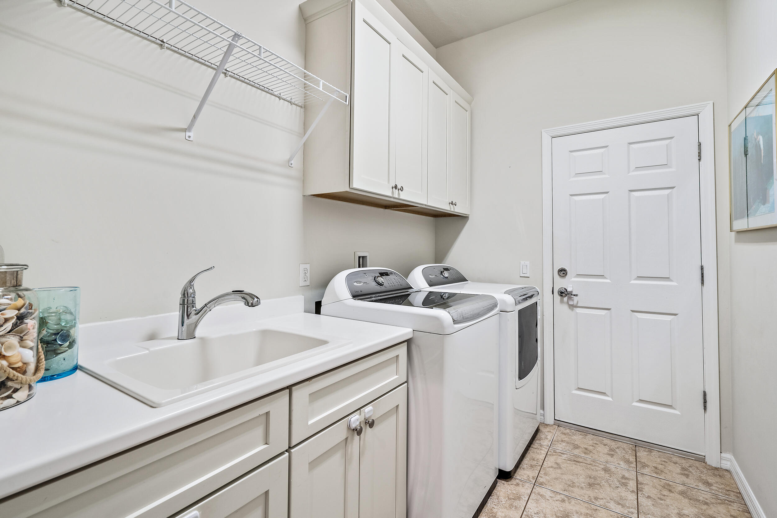 2704 Sunbury Drive Jupiter, FL 33458 - Photo 30 of 50 a utility room with sink dryer and washer
