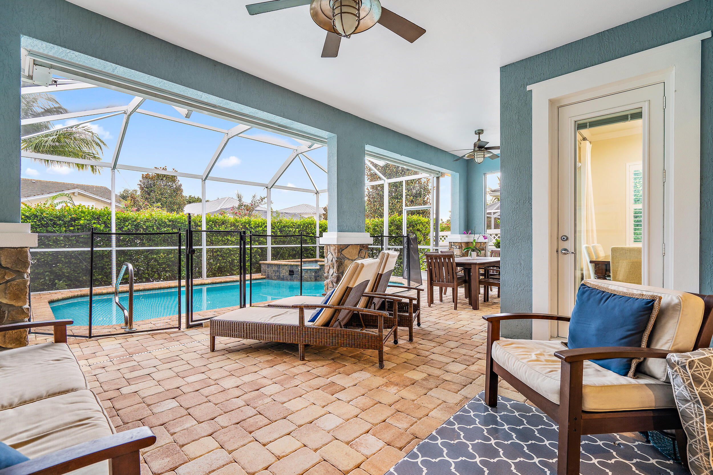 2704 Sunbury Drive Jupiter, FL 33458 - Photo 35 of 50 a living room with furniture and a floor to ceiling window