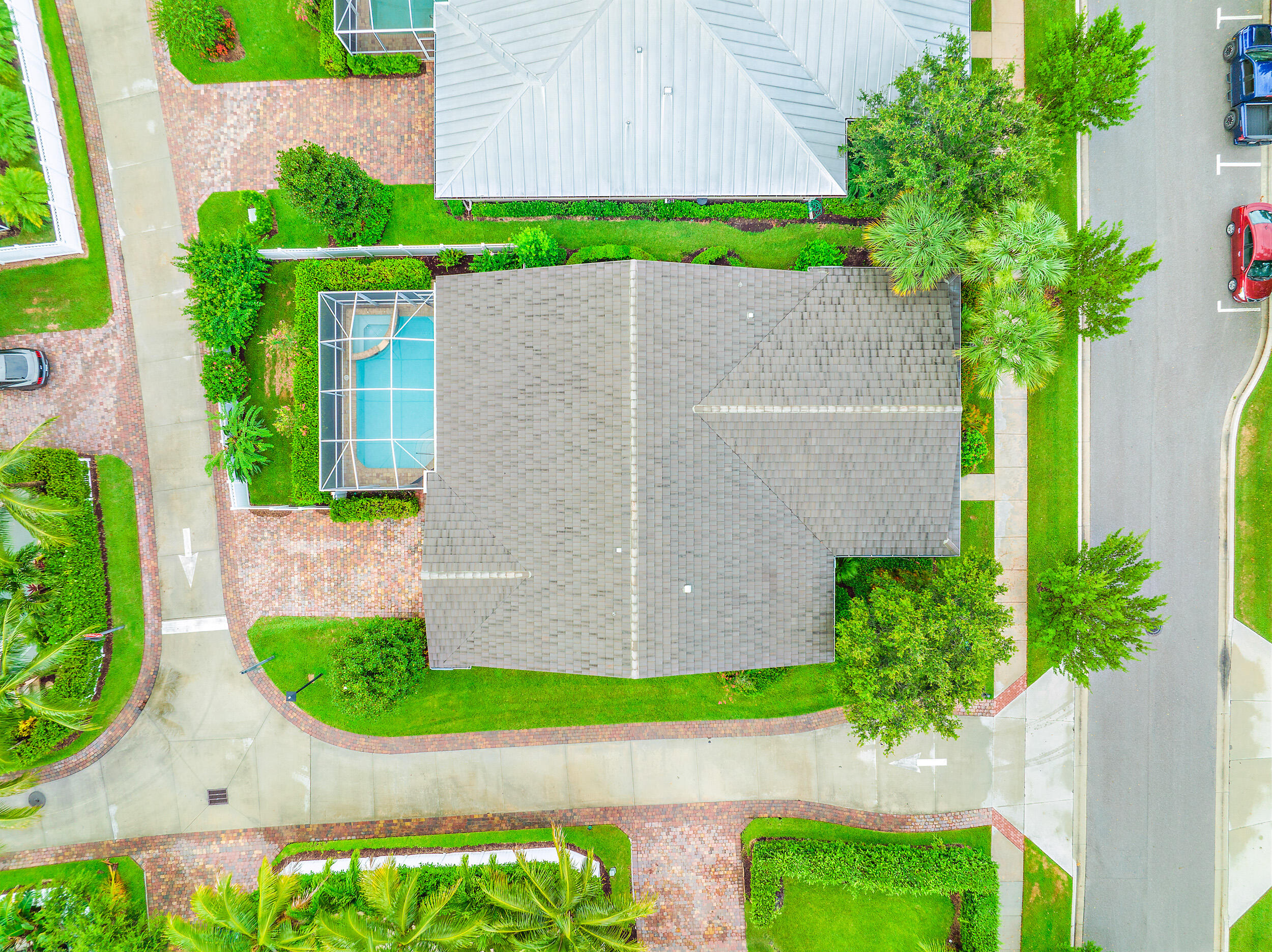 2704 Sunbury Drive Jupiter, FL 33458 - Photo 39 of 50 a front view of a house with a yard and potted plants