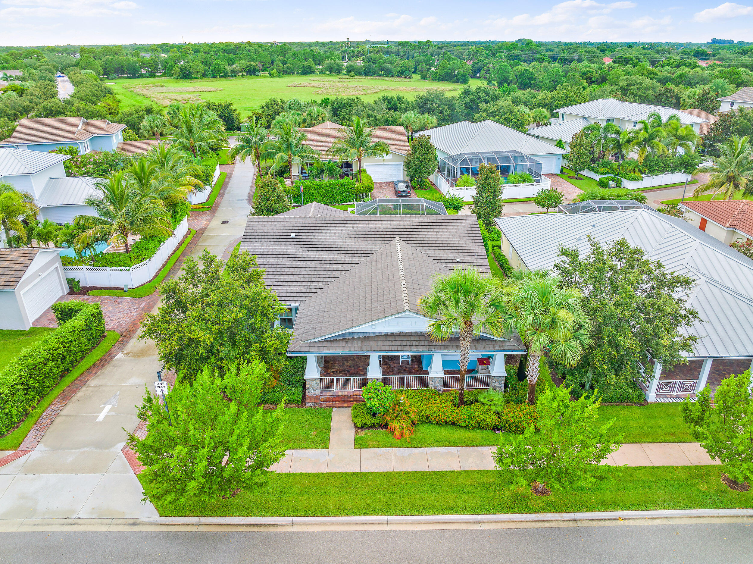 2704 Sunbury Drive Jupiter, FL 33458 - Photo 45 of 50 a front view of a house with garden
