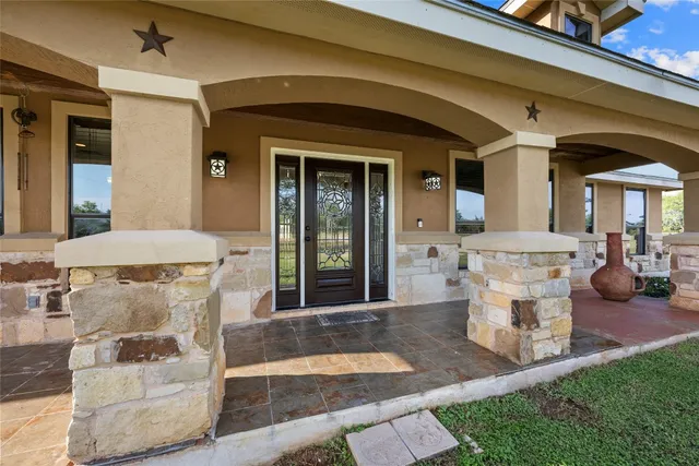 a front view of a house with outdoor seating