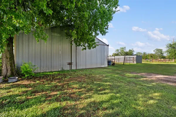 a view of backyard with green space