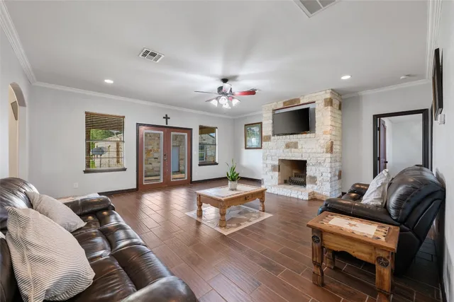 a living room with furniture fireplace and flat screen tv