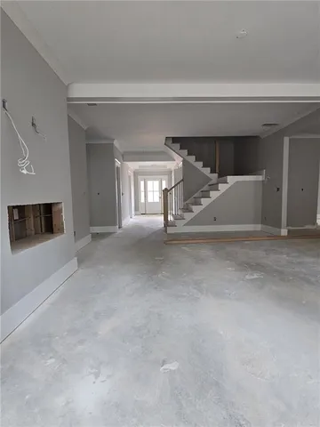 a room with a bed and a large window