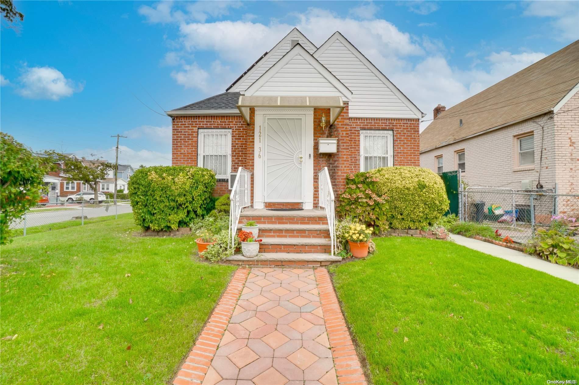 121-36 198th Street Queens, NY 11413 - Photo 1 of 1 a front view of a house with a yard