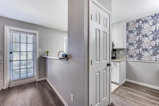 a view of a workspace with furniture and a chandelier