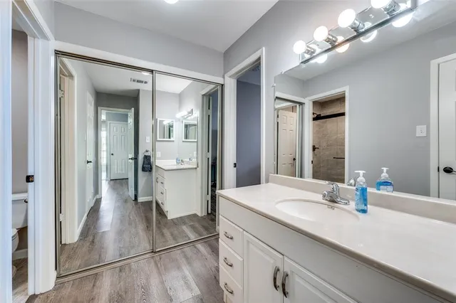 a bathroom with a sink a vanity and a mirror