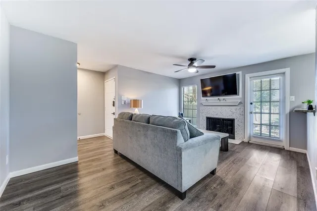 a view of cabinets with wooden floor and window