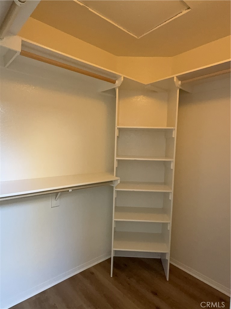 12590 Cobalt Road Victorville, CA 92392 - Photo 29 of 37 a view of walk in closet with empty racks