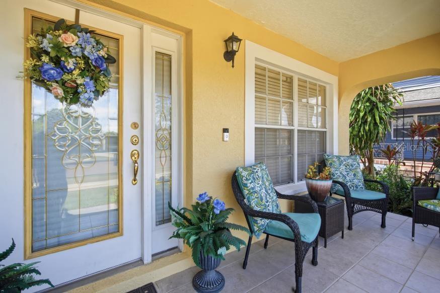 3005 West Chestnut Street Tampa, FL 33607 - Photo 4 of 27 a living room filled with furniture and a potted plant