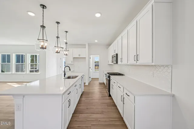 a view of a hallway with white walls