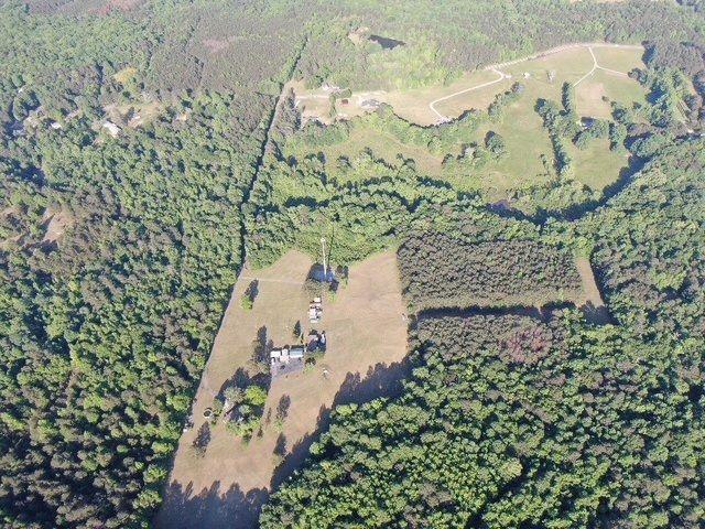 1158 Old Yorkville Road Rockmart, GA 30153 - Photo 7 of 15 an aerial view of a house with a yard and mountain view in back