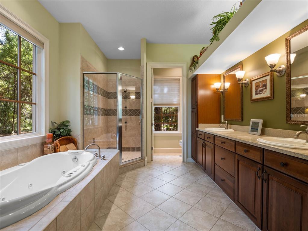 4000 Rouse Road Orlando, FL 32817 - Photo 12 of 53 a spacious bathroom with a large tub shower and sink