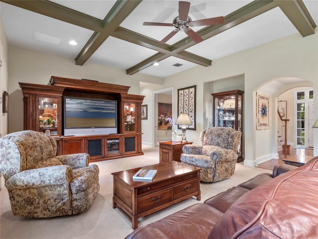 4000 Rouse Road Orlando, FL 32817 - Photo 16 of 53 a living room with furniture and a flat screen tv