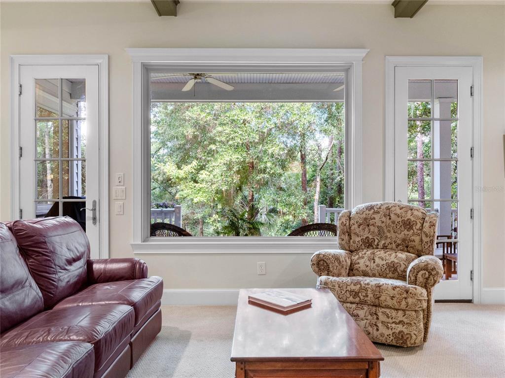 4000 Rouse Road Orlando, FL 32817 - Photo 19 of 53 a living room with furniture and a large window
