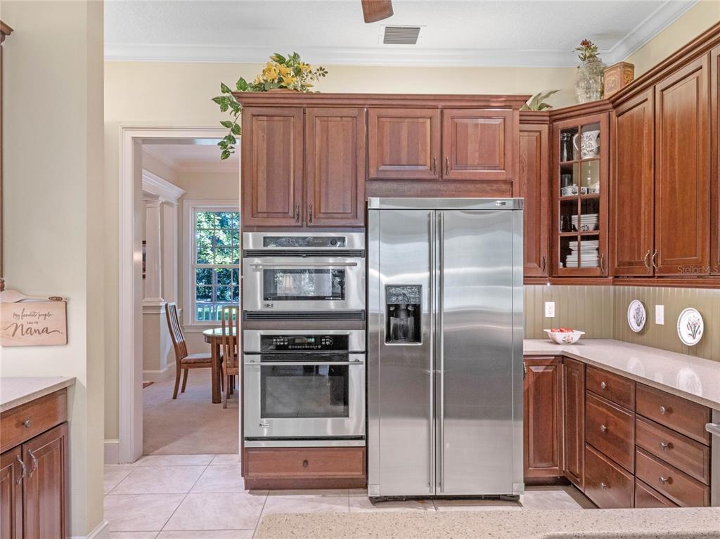 4000 Rouse Road Orlando, FL 32817 - Photo 22 of 53 a kitchen with stainless steel appliances granite countertop a refrigerator and a stove