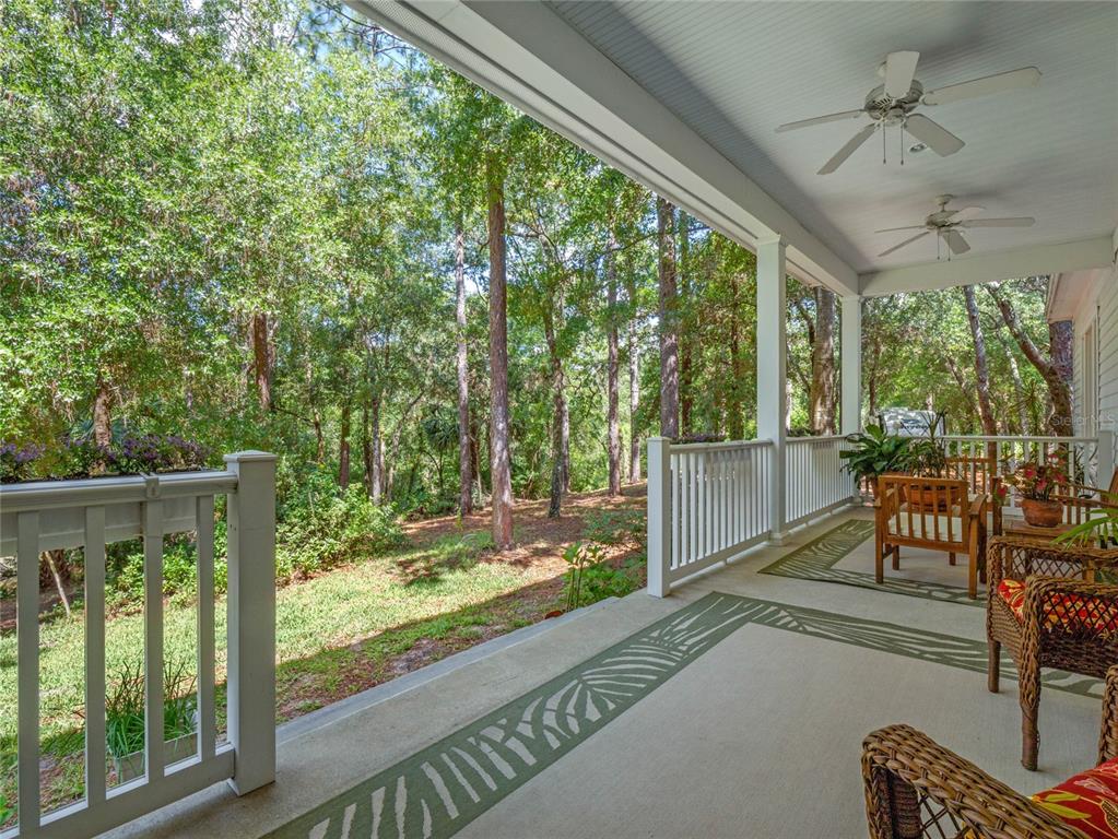 4000 Rouse Road Orlando, FL 32817 - Photo 3 of 53 a view of a porch with furniture and a backyard