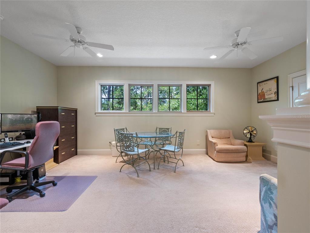 4000 Rouse Road Orlando, FL 32817 - Photo 33 of 53 a view of a workspace with furniture and a window