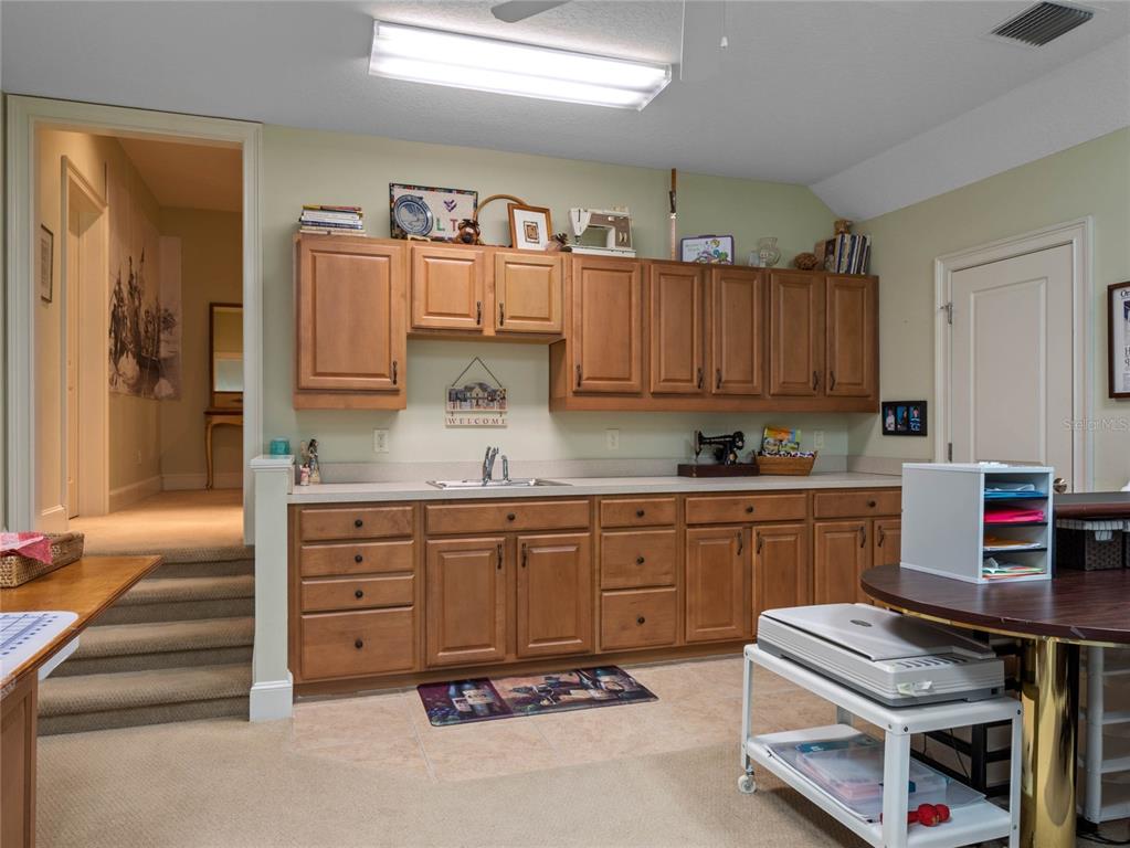 4000 Rouse Road Orlando, FL 32817 - Photo 34 of 53 a kitchen with cabinets and window