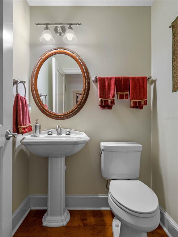 4000 Rouse Road Orlando, FL 32817 - Photo 41 of 53 a bathroom with a toilet sink and mirror